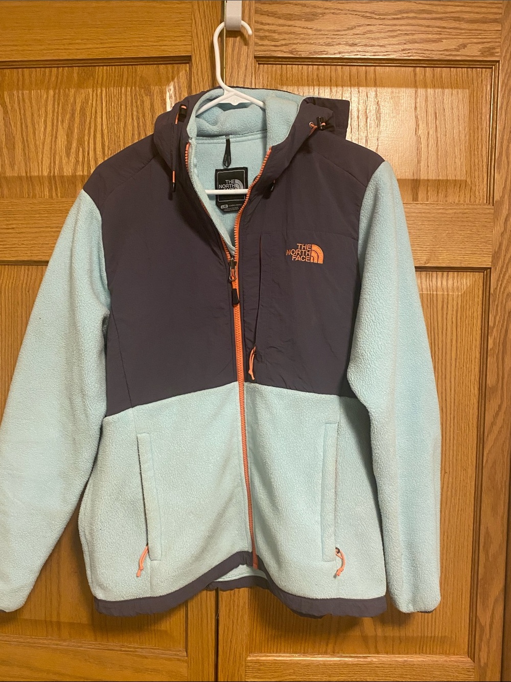 The North Face Light Blue Fleece Jacket with Navy Yoke and Orange Accents